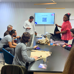 Mökki sorting training, a Mökki staff member provides training to office employees on clothing sorting.